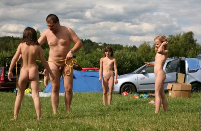 Family naturism outdoors - games, entertainments and picnic