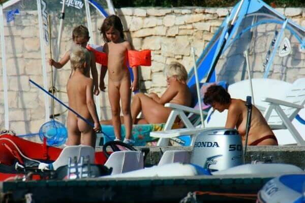 By the boat photos - Benefits of naturist recreation and harmony with nature