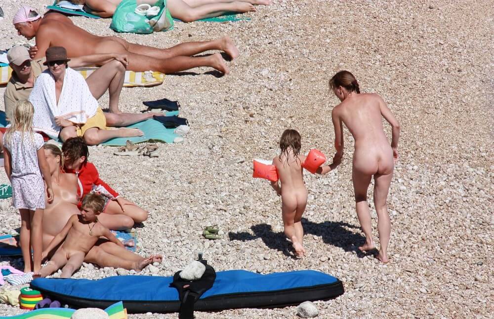 Orange Floaty Safety First Naturist pics - Taking Off Ones Clothes